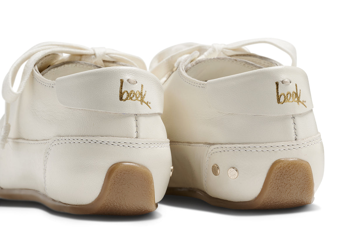 Sandpiper leather sneakers in white - product back detail shot with gold logo