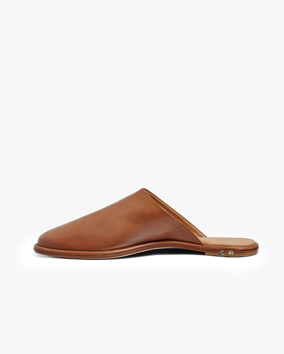 Diagram of Seagull leather mules calling out leather outsole with rubber heel piece soft fully-lined leather upper, leather wrapped memory foam insole, signature beek branding nail heads, molded arch support