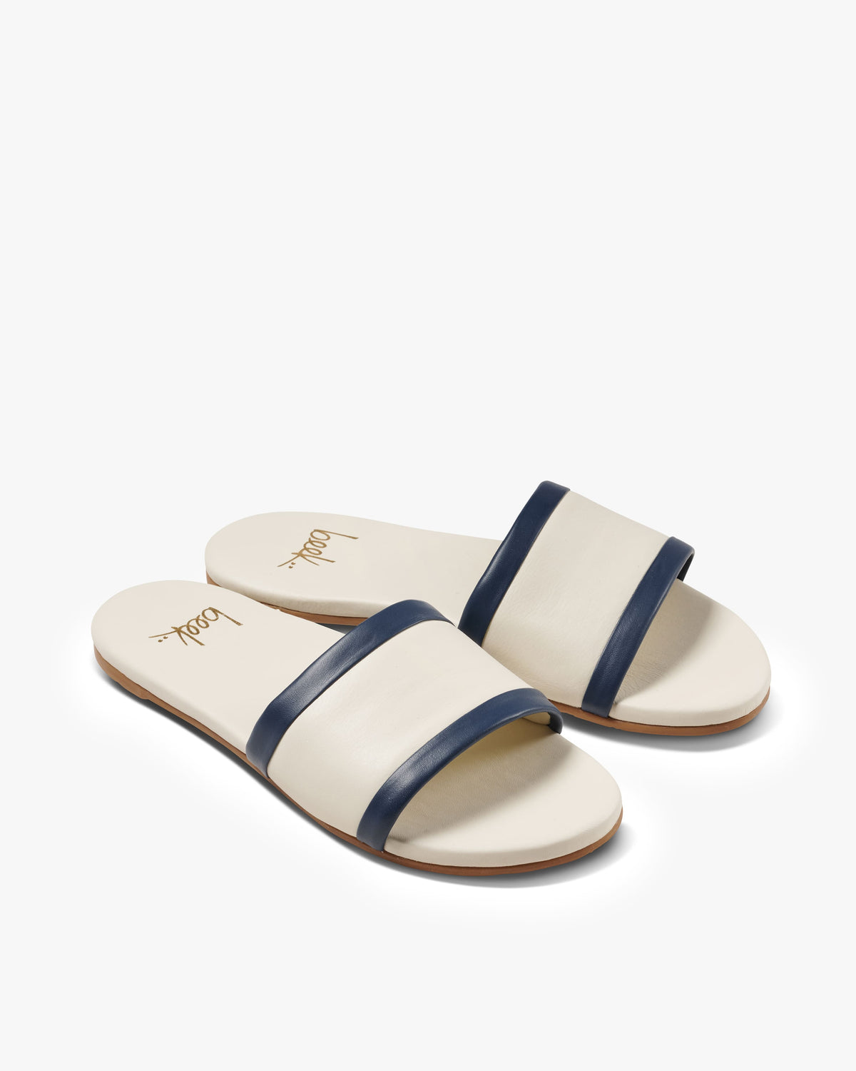 Shorebird leather slide sandal in vanilla/navy - product side shot