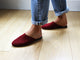 Woman wearing Siskin suede mule in port with jeans.