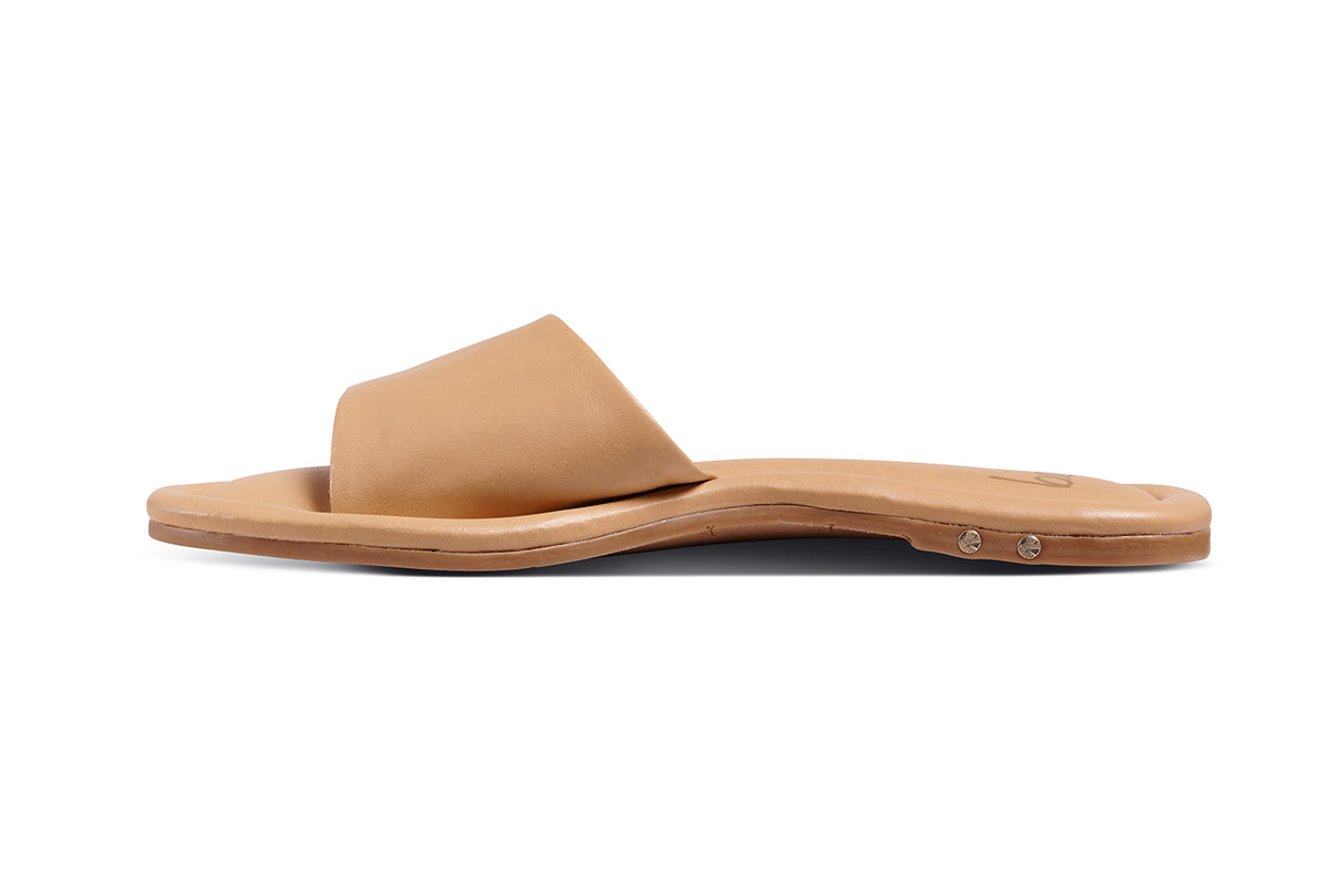Songlark leather slide sandal in beach - product side shot