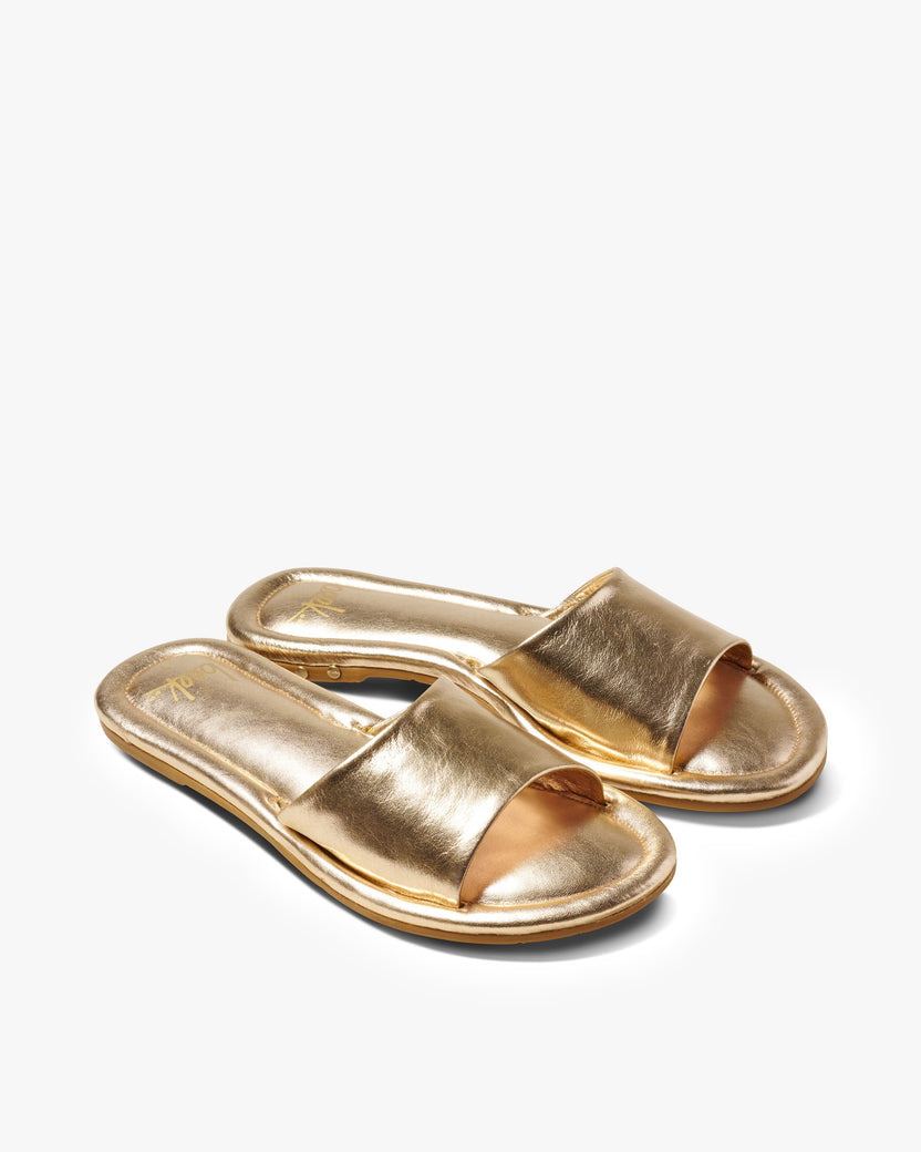 Songlark leather slide sandal in gold - product angle shot