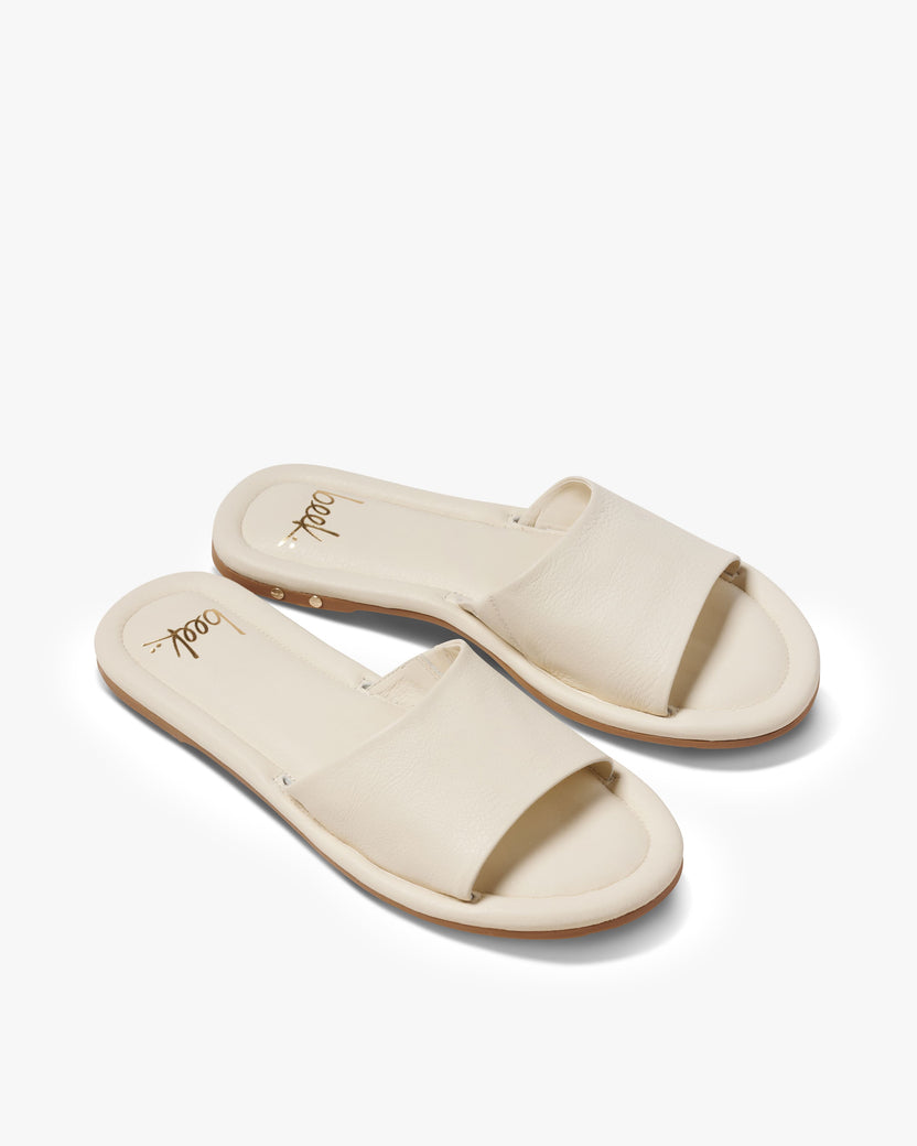 Songlark leather slide sandal in vanilla - product angle shot