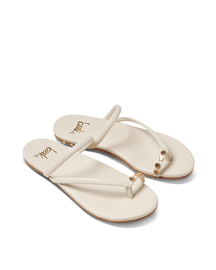 Starbird leather slide sandals in vanilla - product angle shot