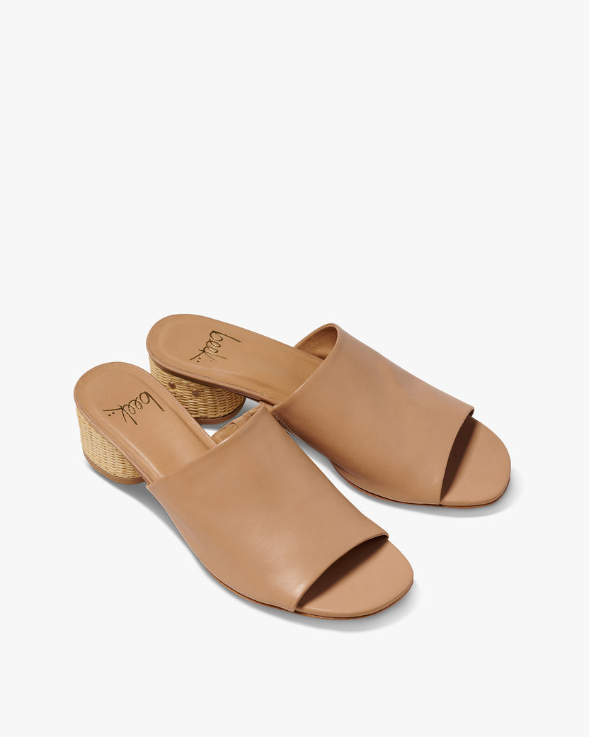 Stilt leather and raffia heeled sandal in beach - product angle shot