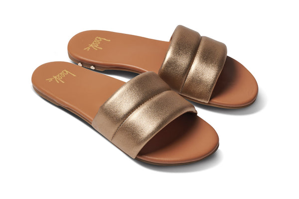 Sugarbird leather slide sandal in gold/honey - angle shot
