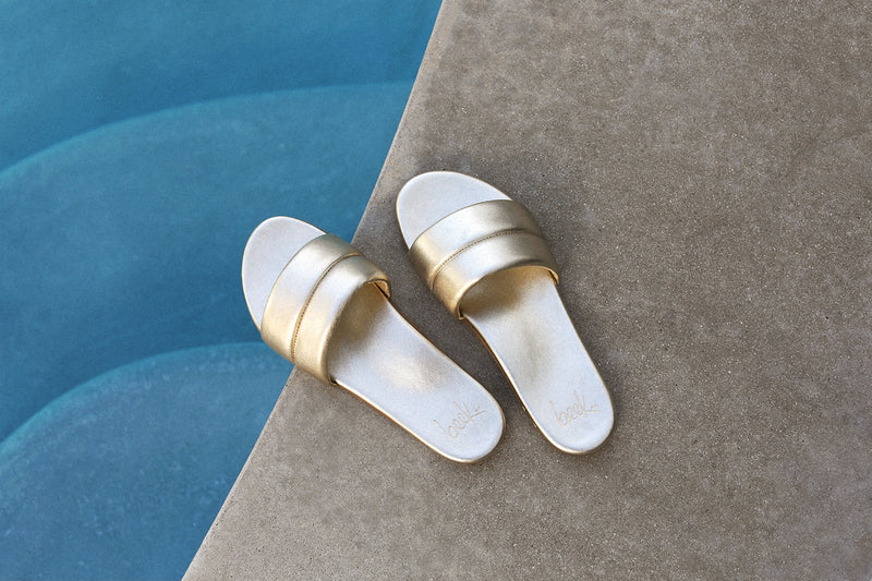 Sugarbird Leather Slide Sandal in platinum  by the pool
