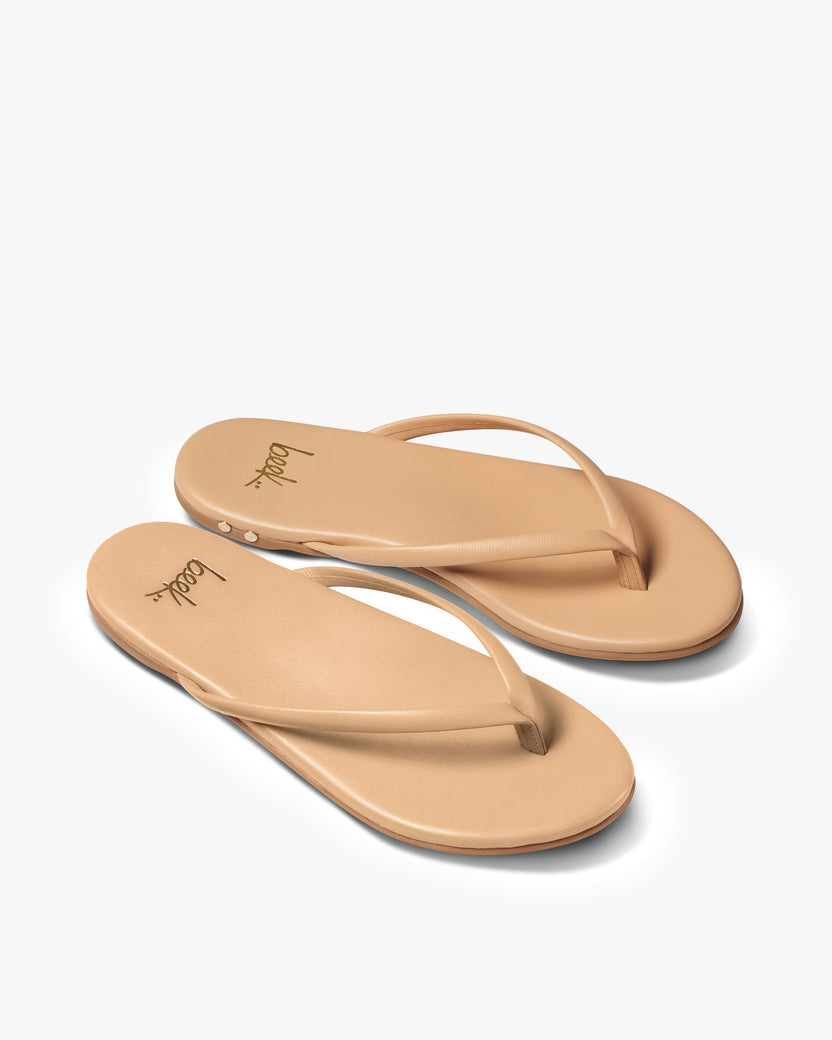 Sunbeam leather flip flop sandal in beach - angle shot