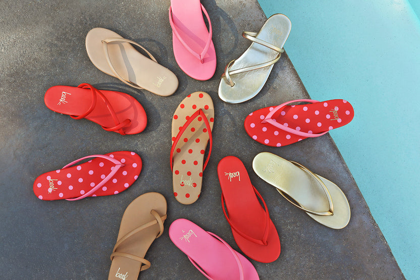 Group shot of Sunbeam leather flip flop sandal in beach, peony, tomato/beach, peony/tomato and Sunbird leather sandals in tomato, gold, beach