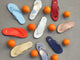 Group shot of Sunbeam leather flip flop sandals in sky, flame, platinum, glow, vanilla, lipstick, beach, navy, bronze.