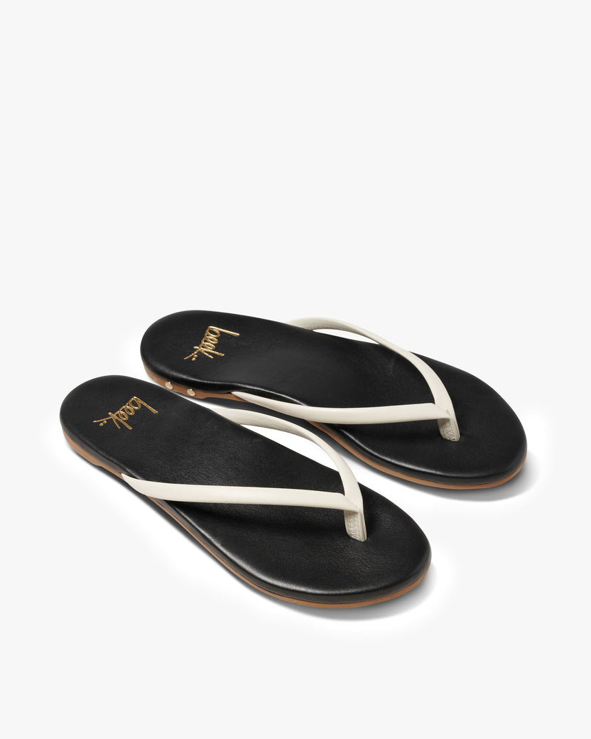Sunbeam leather flip flop sandal in vanilla/black - product angle shot