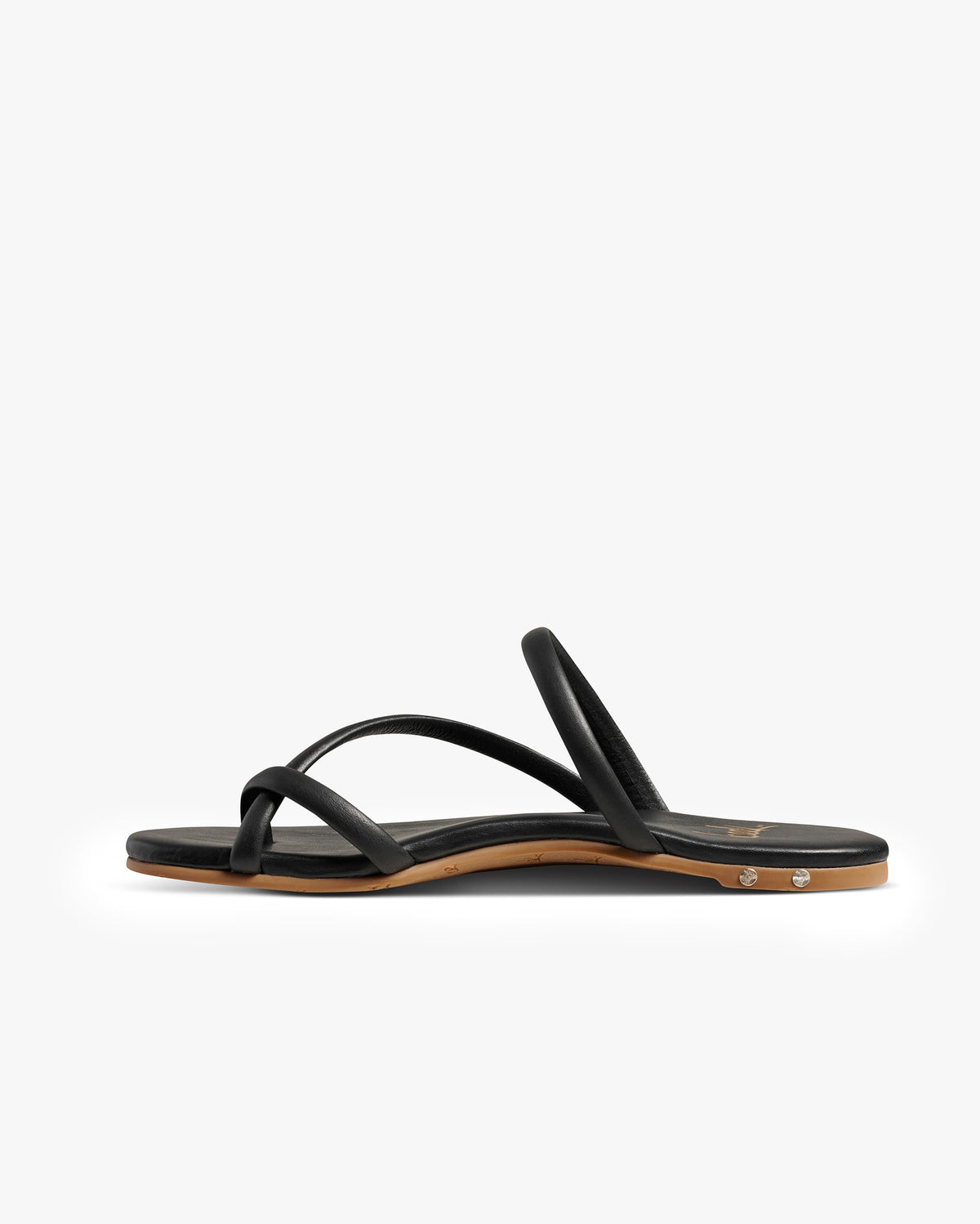 Sunbird leather slide sandals in black - product side shot