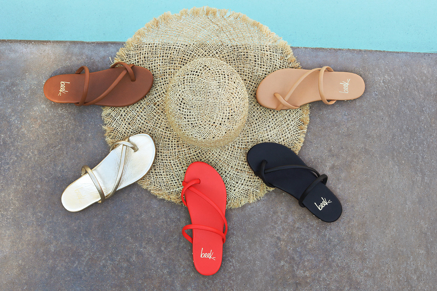 Group shot of Sunbird leather sandals in tan, gold, tomato, black, and beach