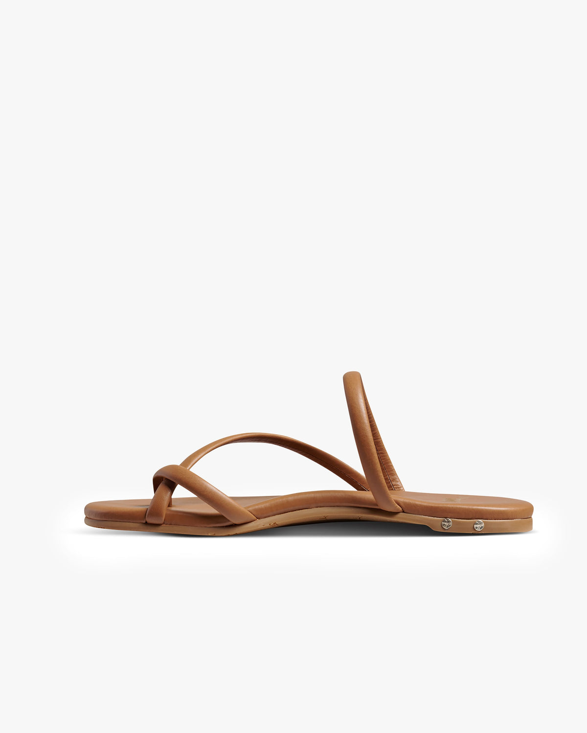 Sunbird leather slide sandals in tan - product side shot