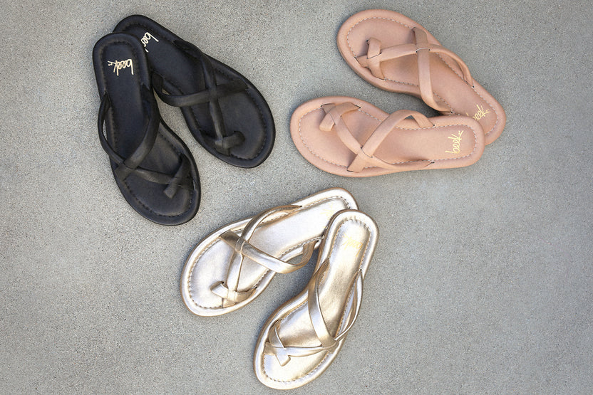 Group shot of Sungem leather toe-ring sandals in black, beach, and gold