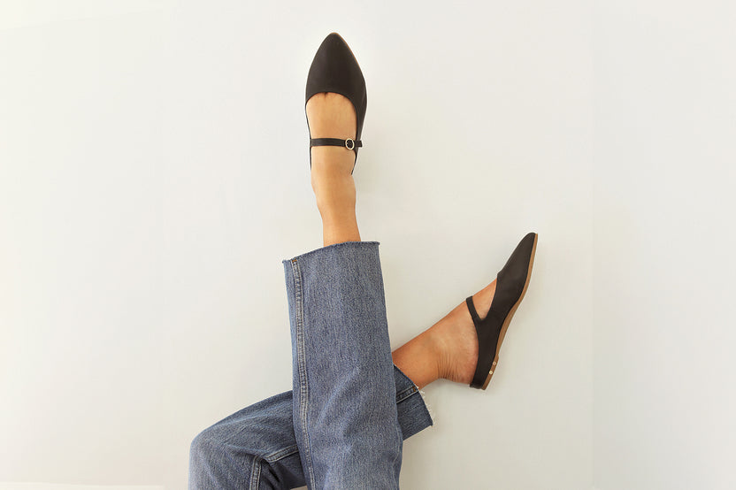 Woman wearing Swallow leather ballet mule in black with jeans
