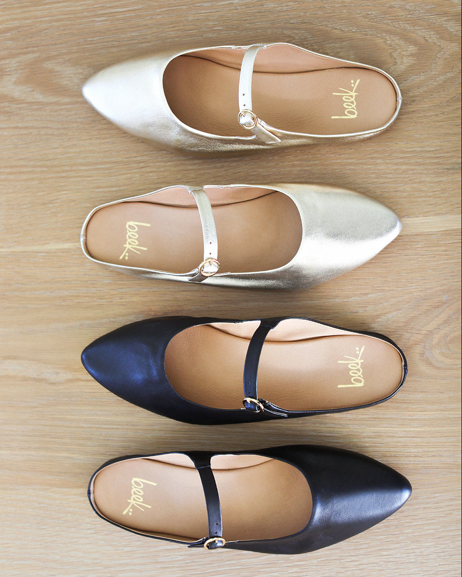 Group shot of Swallow leather ballet mule in black and gold