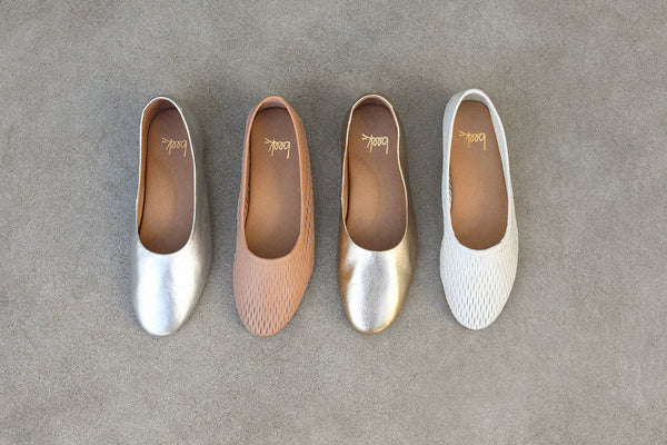 Group shot of Swiftlet leather ballet mule in silver and gold with Swiftlet Perforated leather ballet mules in beach and vanilla.
