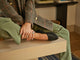 Woman wearing Swoop leather ballet slipper in black with olive pants and tweed jacket