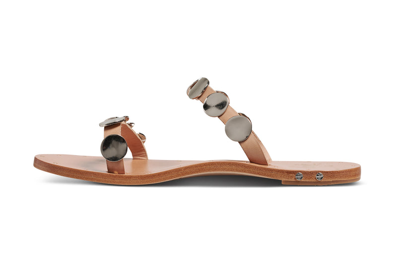 Topaz leather slide sandals in beach with silver metal discs - product side shot