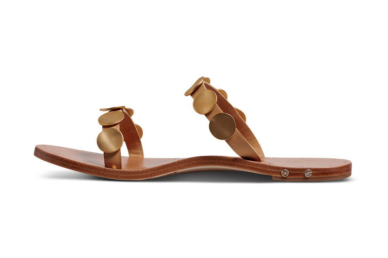 Topaz leather slide sandals in honey with gold accents - product side shot