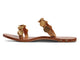 Topaz leather slide sandals in honey with gold accents - product side shot