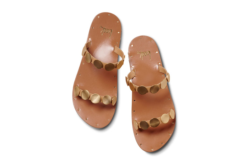 Topaz leather slide sandals in honey with gold accents - product top shot
