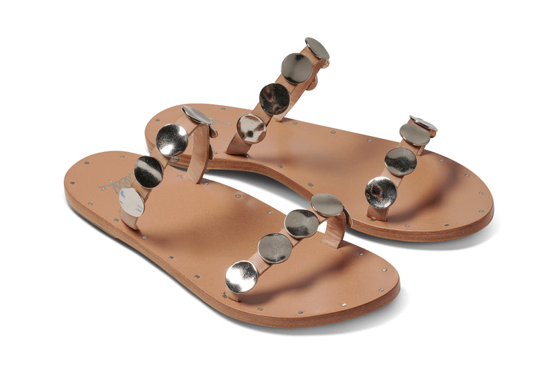 Topaz leather slide sandals in beach with silver metal discs - product angle shot