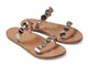 Topaz leather slide sandals in beach with silver metal discs - product angle shot