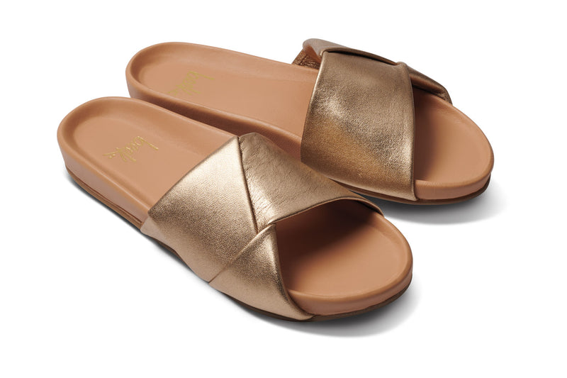 Tori leather slide sandal in gold/beach - angle shot