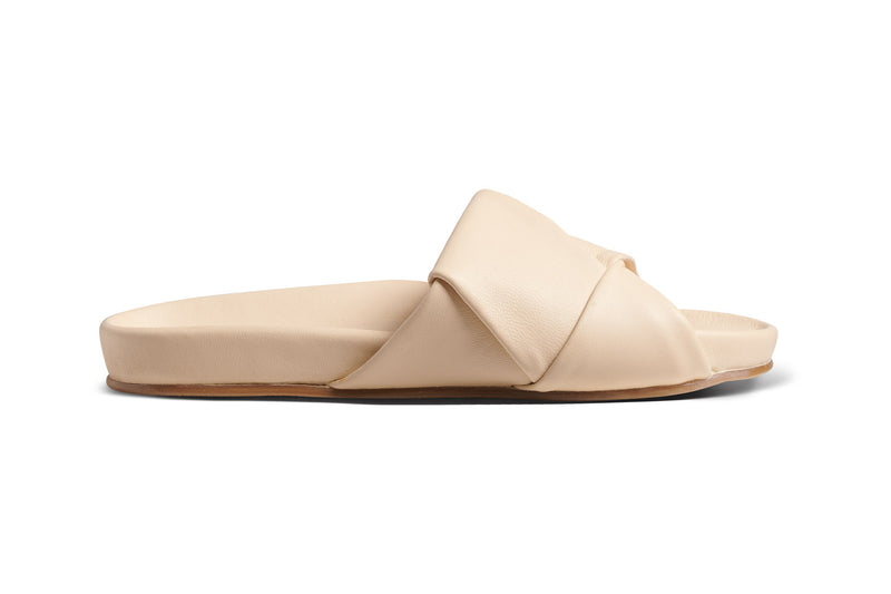 Tori leather slide sandal in macadamia - side shot