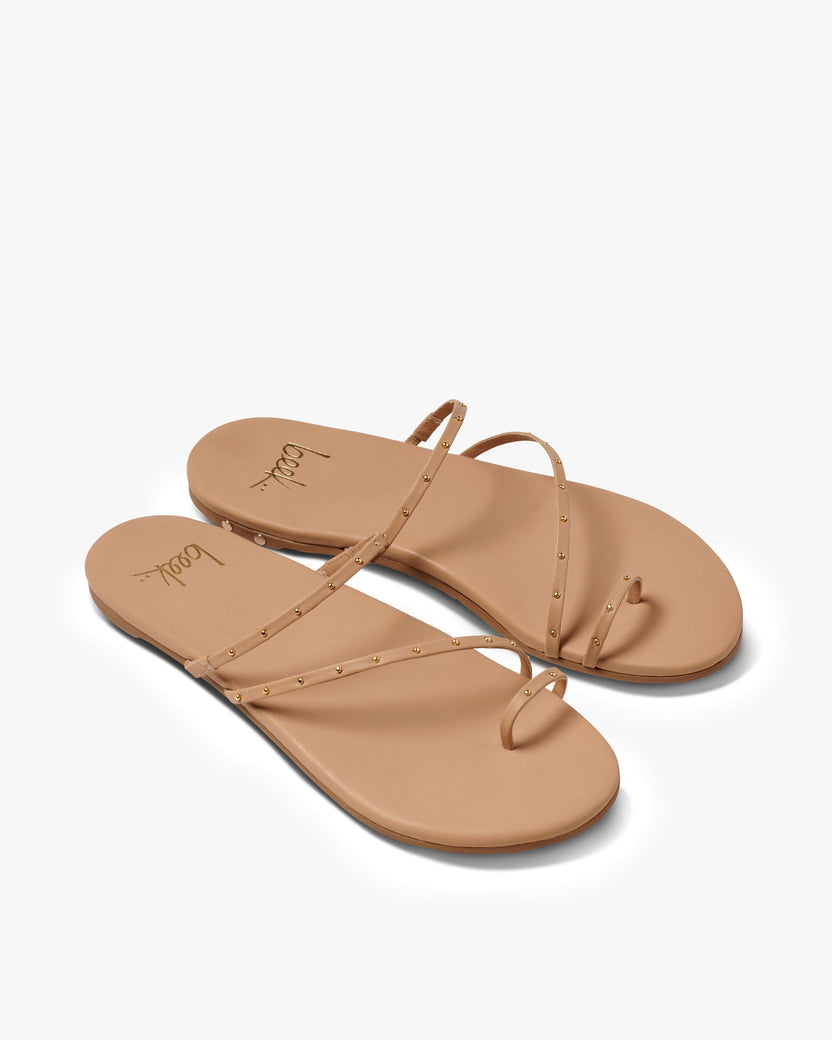 Ula leather slide sandal in beach - product angle shot