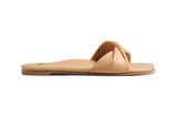Whipbird leather slide sandal in beach - side shot