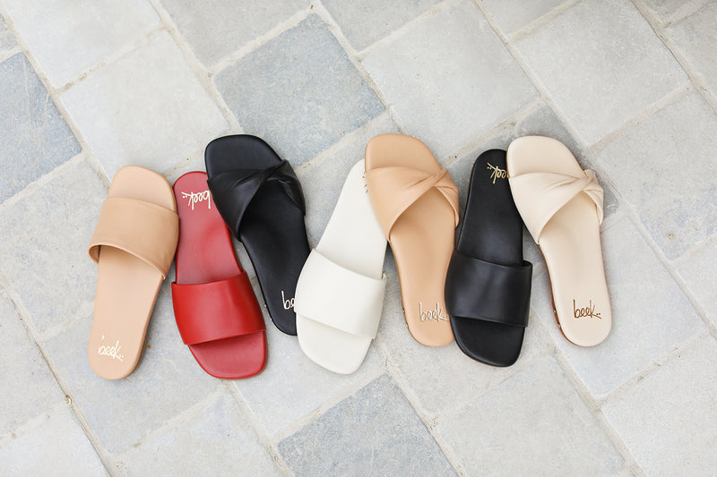 Honeybird leather slide sandals in beach, red, eggshell, black with Whipbird leather slide sandal in black, beach, eggshell