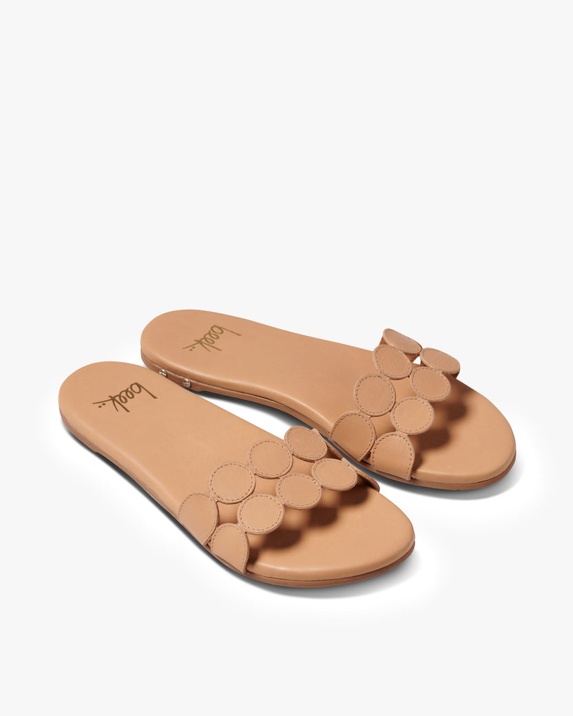 Whirlybird leather slide sandal in beach- product angle shot