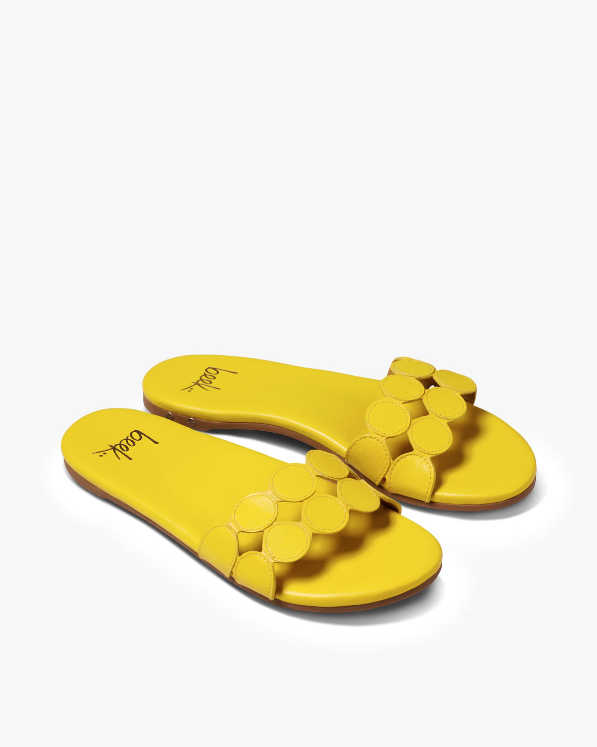 Whirlybird leather slide sandals in lemon - product angle shot