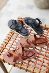 Wigeon burnished leather toe-ring sandal in black and cognac