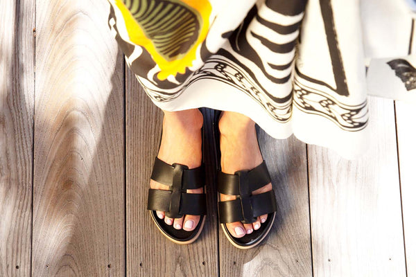 Woman wearing Courser leather slide sandal in black