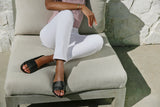 Woman wearing Gallito slide sandal in black