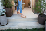 Woman wearing Oriole leather platform sandal in beach