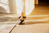 Woman wearing Pato leather platform sandal in black