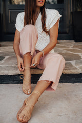 @shalicenoel wearing Seriema ankle wrap sandal in beach.