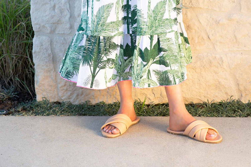 Woman wearing Surfbird leather slide sandal in honey