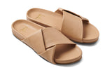 Tori leather slide sandal in beach - product angle shot