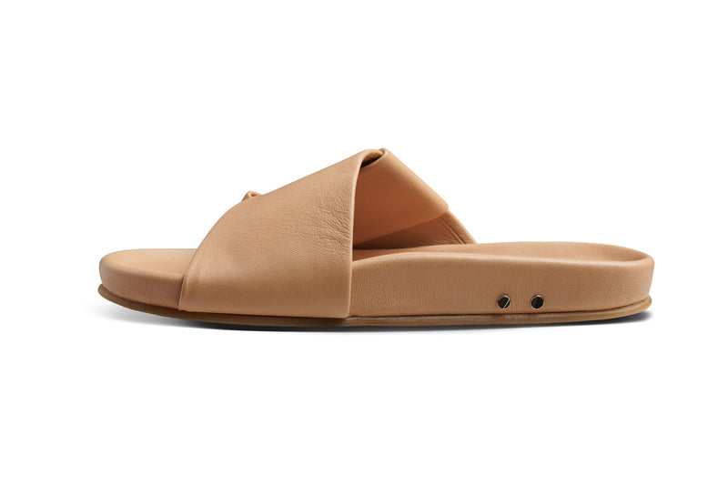 Tori leather slide sandal in beach - product inside shot