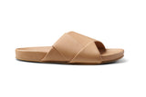 Tori leather slide sandal in beach - product outside shot