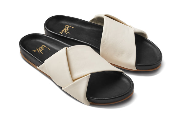 Tori leather slide sandal in eggshell/black - product angle shot