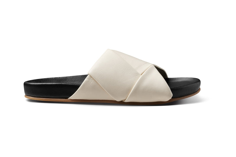 Tori leather slide sandal in eggshell/black - product outside shot